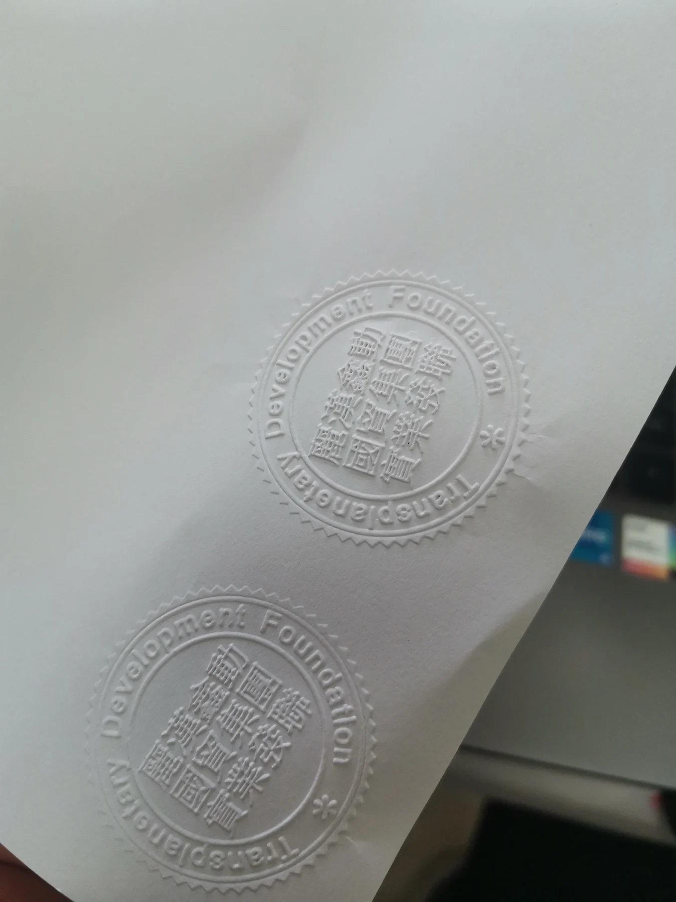 Finished custom embossing impression produced with laser-made POM dies