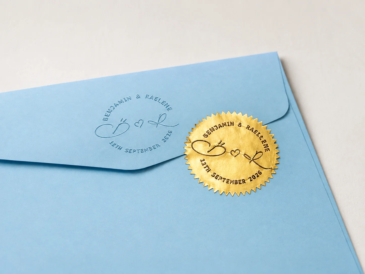 Blue envelope with embossed design and gold label