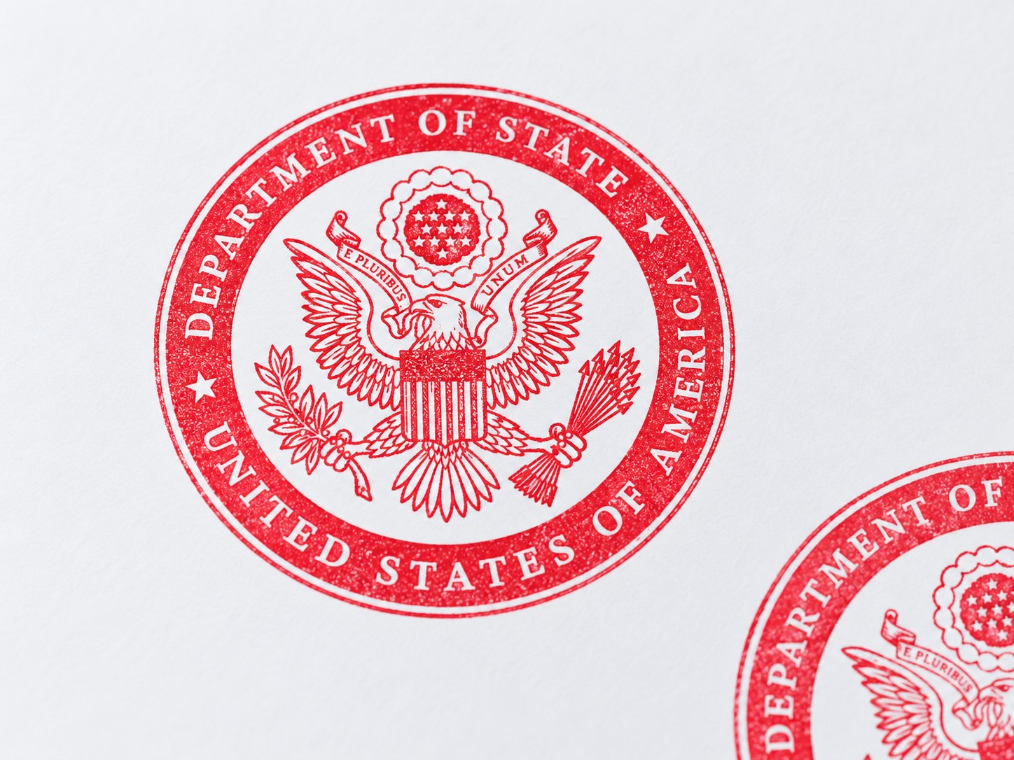 Detailed red stamp impression produced from an engraved rubber sample